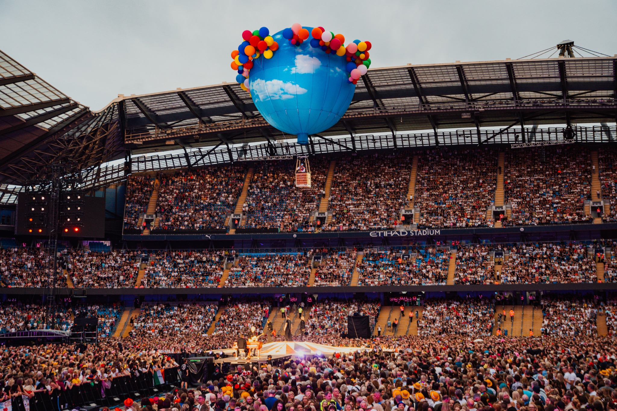 Take That performing to a packed Etihad Stadium crowd in Manchester